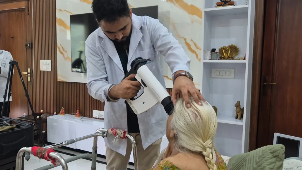 Doctor using a portable fundus camera on an elderly patient at home