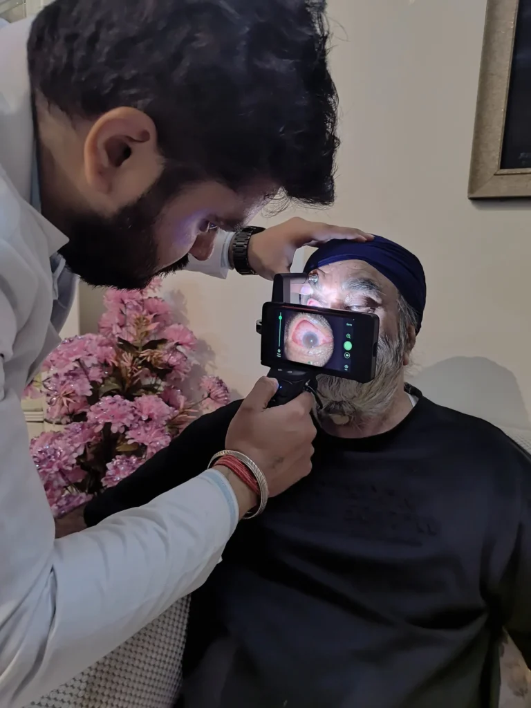 Doctor photographing a patient's eye with a phone-based camera
