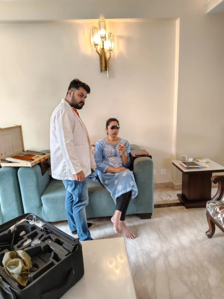 Optometrist with a patient and the portable kit in a living room